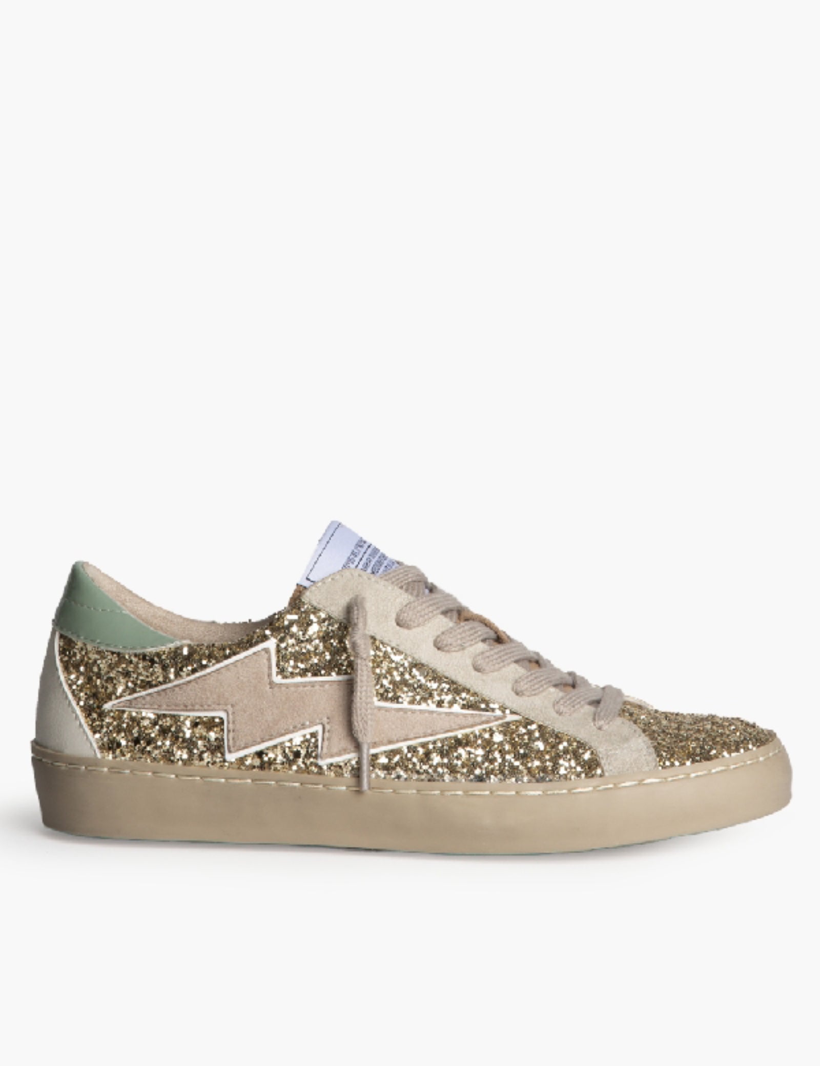 Sneaker bassa in ecocamoscio ricoperta da glitter oro, con patch fulmine sul lato esterno. Brand corina, calzata regolare, colore oro, articolo M6022