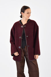Cappottino riccio con alamari