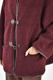 Cappottino riccio con alamari