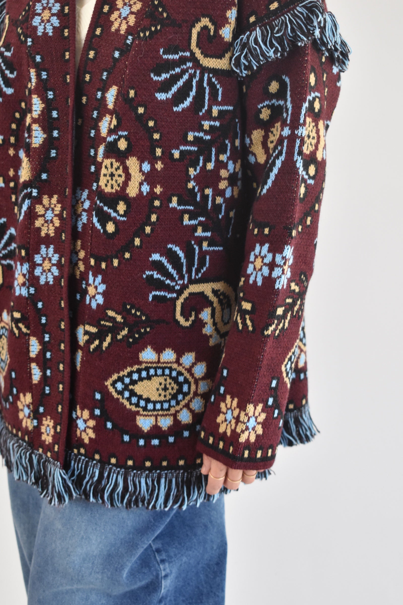 Cardigan jaquard e frangine