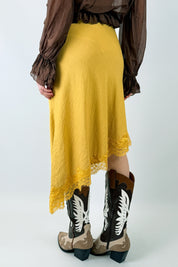 Top gonna asimmetrico pizzo