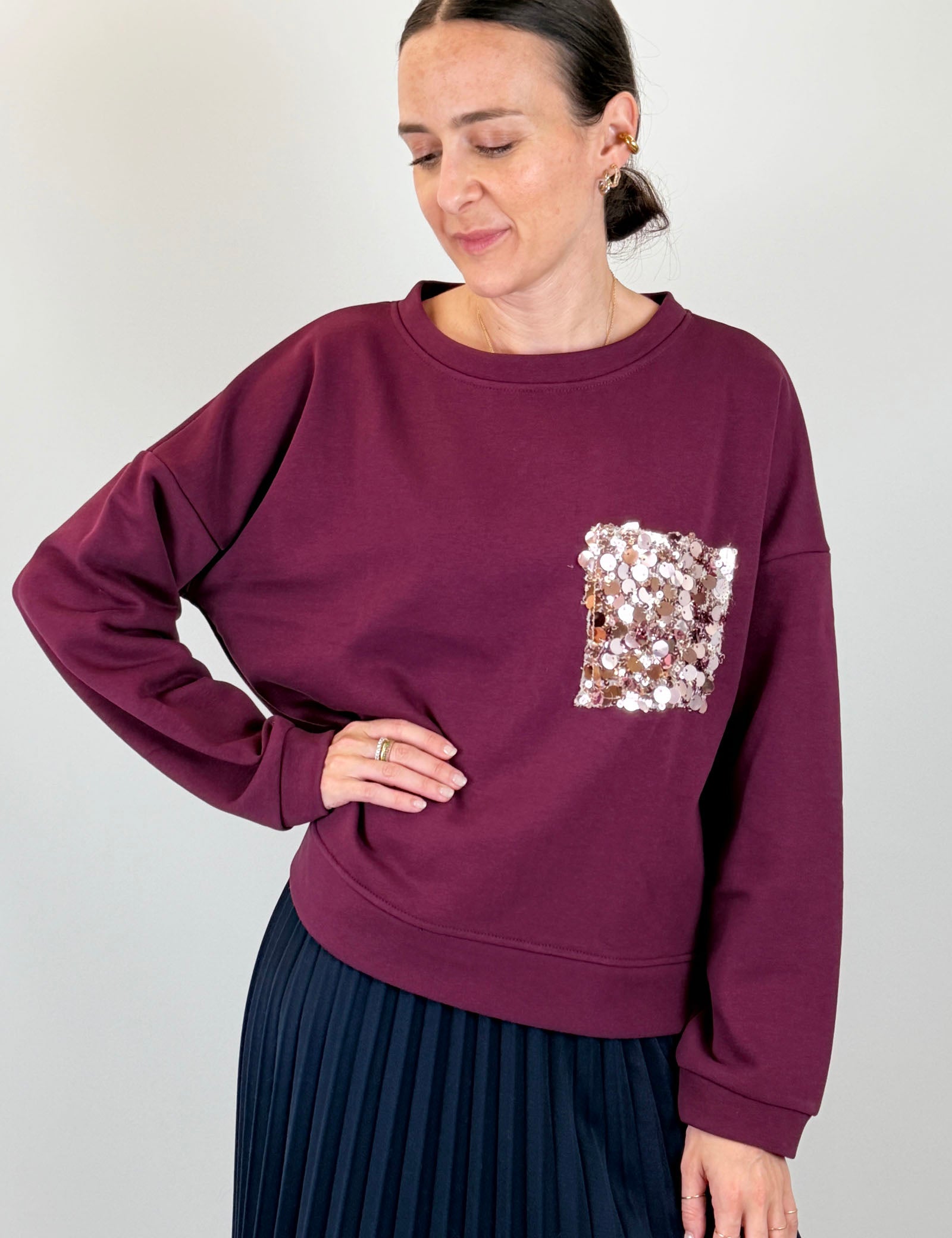 Felpa con tasca paillettes