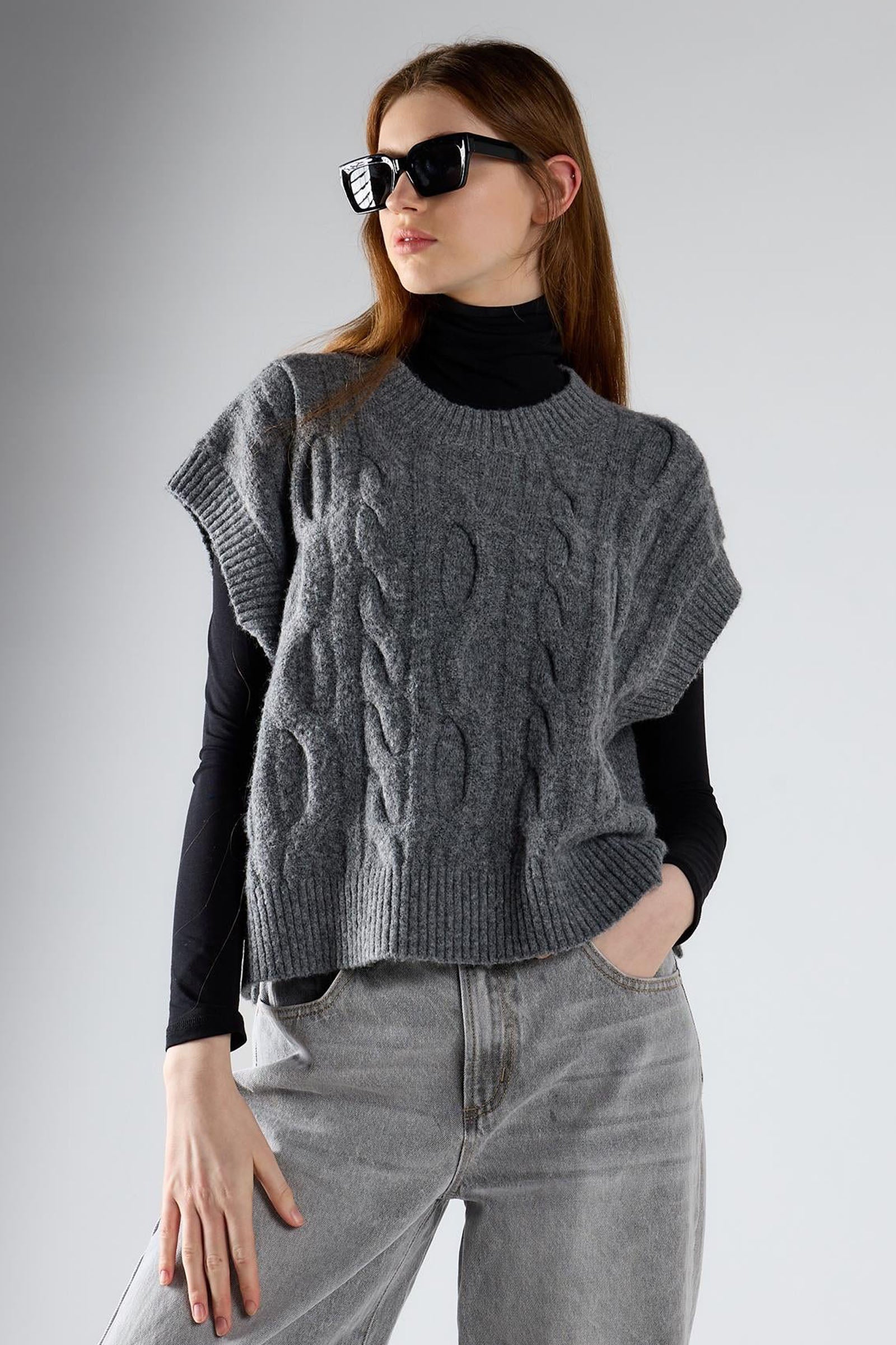 Gilet trecce girocollo
