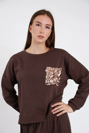 Felpa con tasca paillettes