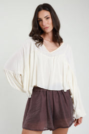 Blusa con balza scollo a V