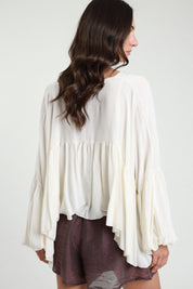 Blusa con balza scollo a V